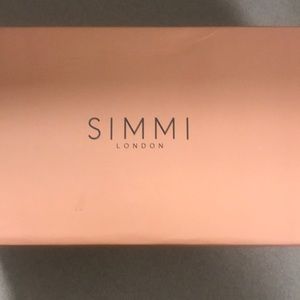 Clear black mule heels with gold heel.